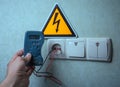 Electrician makes electrical measurements; jumps tension, elect Royalty Free Stock Photo