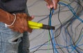 Electrician male right hand holding pliers working install wire power cable . professional technician worker cut wire electric