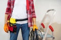 Electrician man with tools and wire cable. Royalty Free Stock Photo