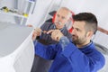 Electrician and manager repairman fixing air conditioning Royalty Free Stock Photo