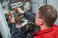 Electrician measurements with multimeter tester Royalty Free Stock Photo