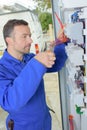 Electrician mending electrical panel Royalty Free Stock Photo