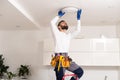 Electrician mounting ceiling lamp - installing the wires. Royalty Free Stock Photo