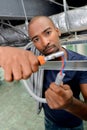 electrician with pliers at work Royalty Free Stock Photo
