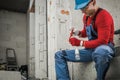 Electrician Preparing Light Point Inside Newly Developed Concrete Bricks House