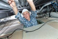 Electrician reaching into roof space Royalty Free Stock Photo