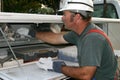 Electrician Reaching in Truck Royalty Free Stock Photo