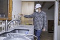 Electrician in remodeled kitchen