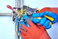 Electrician removes insulation from wires Royalty Free Stock Photo