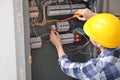 Electrician repairing distribution board