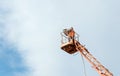 Electrician repairing street light