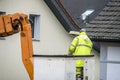 Electrician repairing street lights on lift