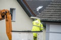 Electrician repairing street lights on lift