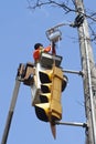 Electrician repairing traffic light