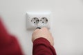 Electrician repairing wall sockets on white, closeup