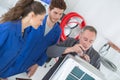 Electrician repairman fixing air conditioning in house