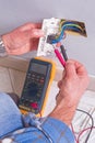 Electrician working in the electrical plant. Royalty Free Stock Photo