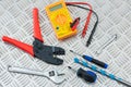 Electrician`s Tools and Equipment on Metal Checker Plate Royalty Free Stock Photo