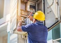 Electrician screwing equipment repairing in fuse circuit breaker box Royalty Free Stock Photo