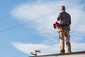 Electrician standing on rooftop Royalty Free Stock Photo