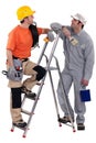 Electrician stood with painter Royalty Free Stock Photo