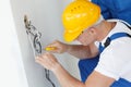 Electrician stripping electrical wires Royalty Free Stock Photo