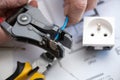 Electrician stripping a wire Royalty Free Stock Photo