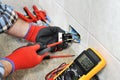 Electrician technician working safely on a residential electrical system. Royalty Free Stock Photo