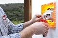 Electrician technician repairs the electrical panel of a residential system Royalty Free Stock Photo