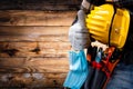 Electrician technician with tool belt and surgical mask on rustic wooden background. Electricity. Covid-19 prevention Royalty Free Stock Photo