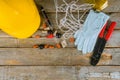 Electrician technician at work prepares the tools and cables used in electrical installation and yellow helmet