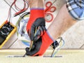 Electrician technician at work with safety equipment on a residential electrical system Royalty Free Stock Photo