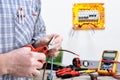 Electrician technician at work on a residential electric system Royalty Free Stock Photo