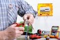 Electrician technician at work on a residential electric system Royalty Free Stock Photo