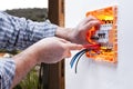 Electrician technician repairs the electrical panel of a residential system Royalty Free Stock Photo