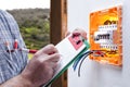 Electrician technician repairs the electrical panel of a residential system Royalty Free Stock Photo