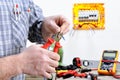 Electrician technician at work on a residential electric system Royalty Free Stock Photo