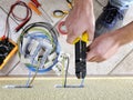 Electrician technician at work on a residential electric system Royalty Free Stock Photo