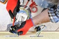 Electrician technician at work with safety equipment on a residential electrical system