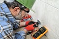 Electrician technician working safely on a residential electrical system. Royalty Free Stock Photo