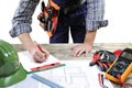 Young electrician technician analyzes the project of a residential building Royalty Free Stock Photo