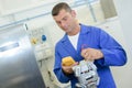 Electrician testing electrical component