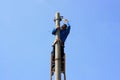 Electrician on the tower electric pole