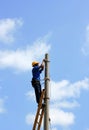 Electrician on the tower electric pole