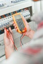 Electrician using multi meter Royalty Free Stock Photo