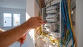 Electrician carefully wiring circuit breaker panel Royalty Free Stock Photo
