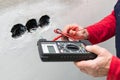 Electrician using voltmeter Royalty Free Stock Photo