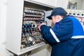 Electrician at voltage adjusting Royalty Free Stock Photo