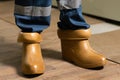 Electrician wears rubber boots for safety to avoid electric shock. Concept of electric power station development