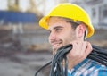 Electrician with wires cables on building site Royalty Free Stock Photo